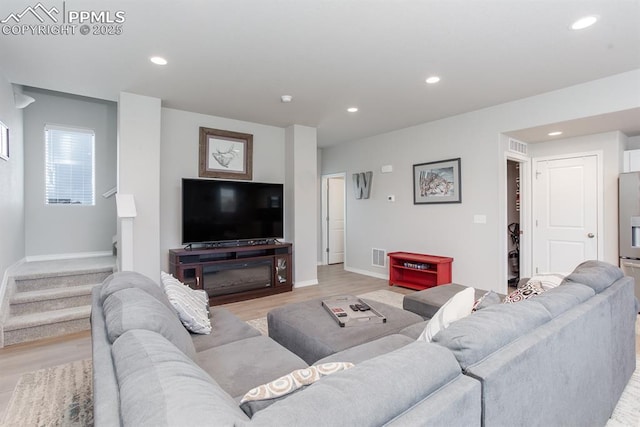 living room with light hardwood / wood-style floors