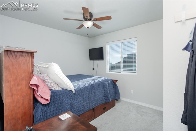 bedroom featuring ceiling fan and light carpet