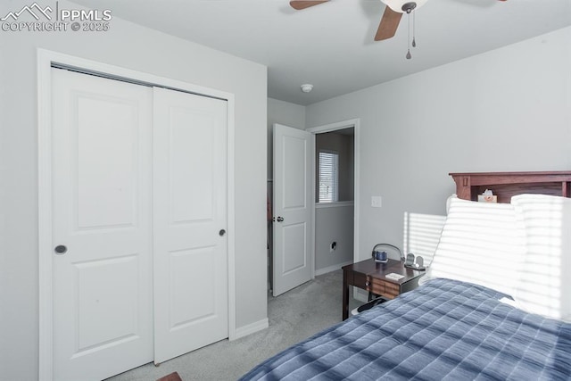 bedroom featuring ceiling fan, a closet, and carpet