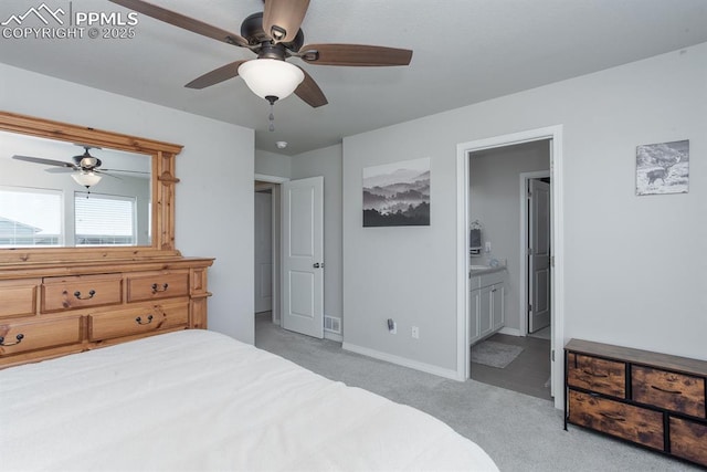 bedroom featuring ensuite bathroom, ceiling fan, and light colored carpet