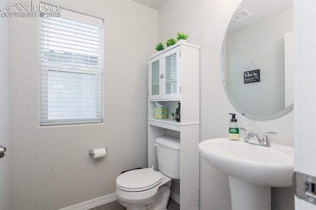 bathroom featuring sink and toilet