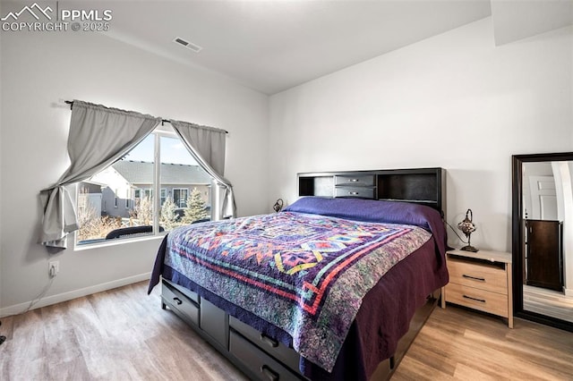 bedroom with light wood-type flooring