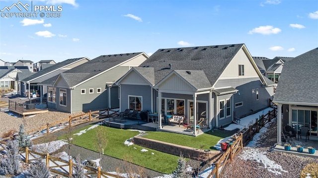 back of property featuring a yard and a patio