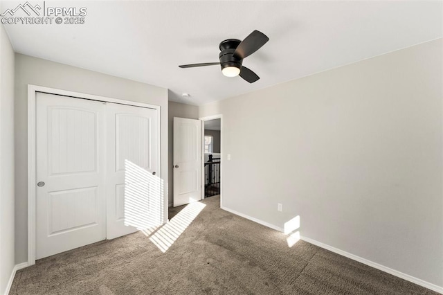 unfurnished bedroom with ceiling fan, a closet, and carpet floors