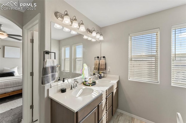 bathroom with ceiling fan and vanity