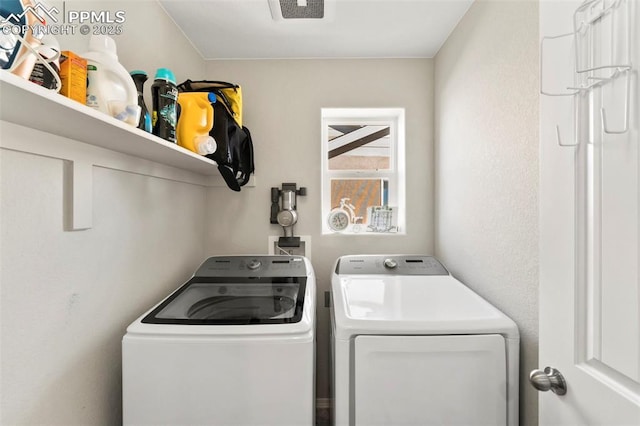 clothes washing area with washing machine and clothes dryer