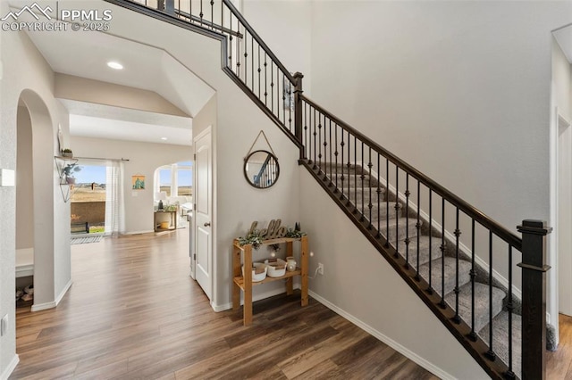 stairway with hardwood / wood-style flooring