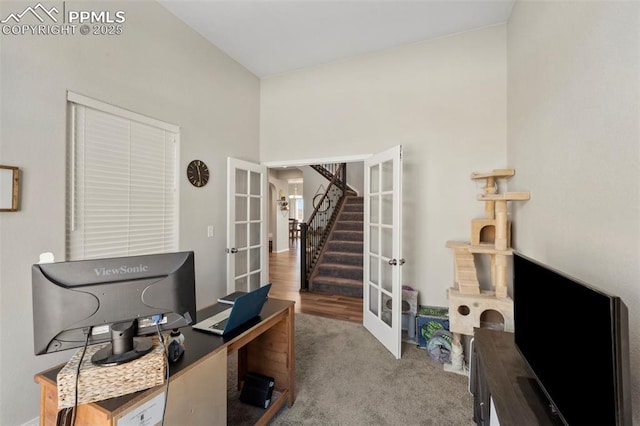 carpeted office space with french doors