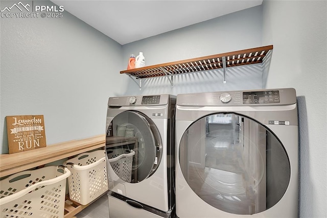 laundry room featuring washing machine and dryer