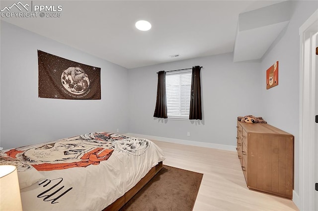 bedroom with light hardwood / wood-style floors