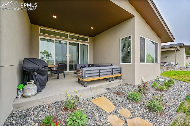 view of patio / terrace with an outdoor living space and grilling area