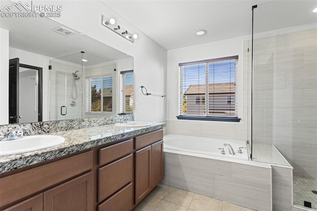 bathroom featuring tile patterned flooring, vanity, and independent shower and bath