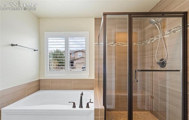 bathroom featuring plus walk in shower