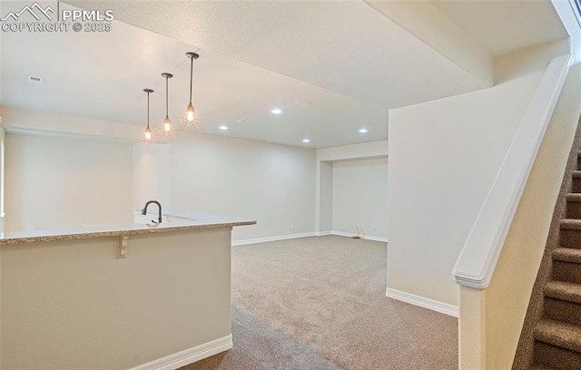 interior space with decorative light fixtures and light colored carpet