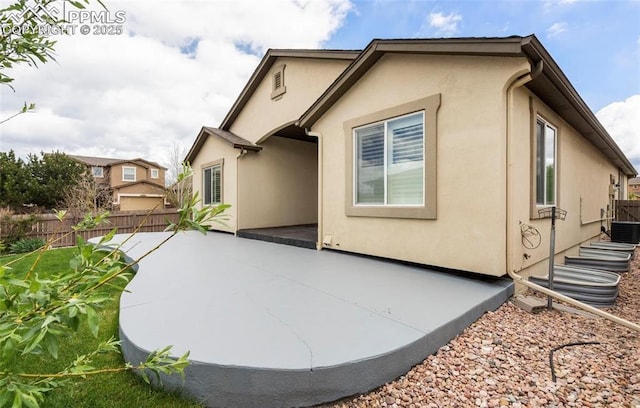 view of property exterior featuring a patio