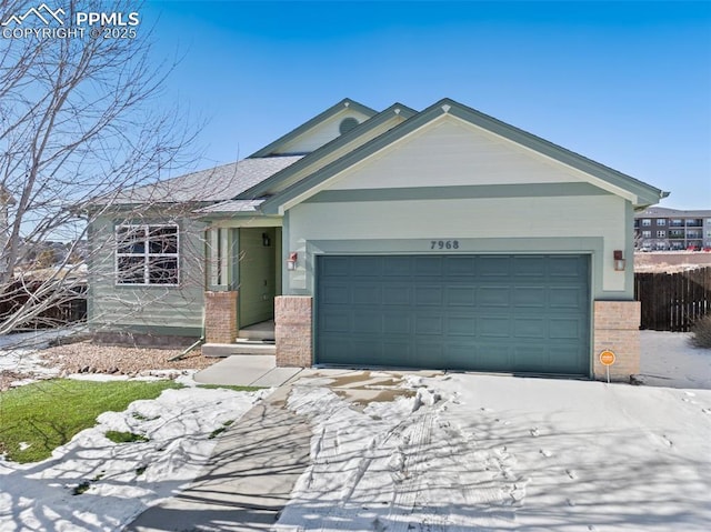 ranch-style home featuring a garage