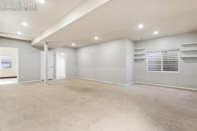 unfurnished living room featuring light carpet