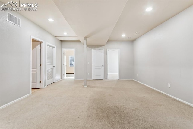 empty room featuring light colored carpet