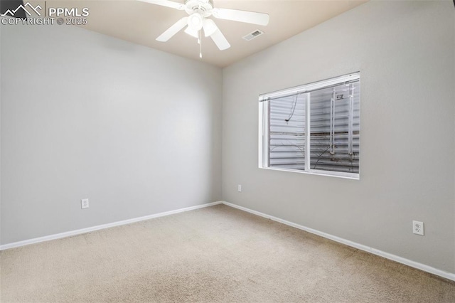 spare room with ceiling fan and carpet floors