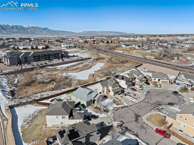 birds eye view of property with a mountain view