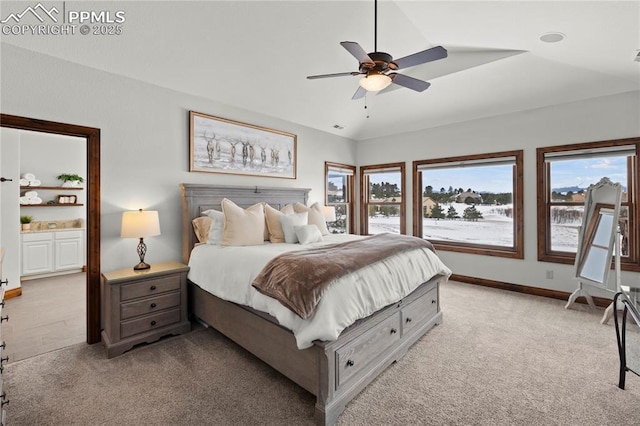 carpeted bedroom featuring ceiling fan and lofted ceiling