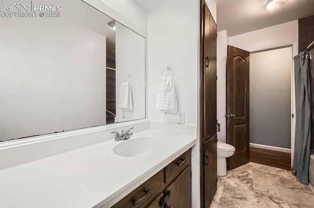 bathroom featuring vanity and toilet