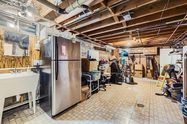 basement featuring stainless steel fridge