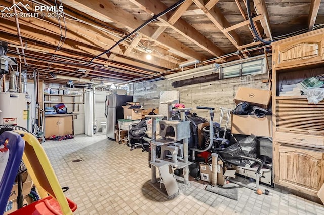 basement with stainless steel fridge and water heater