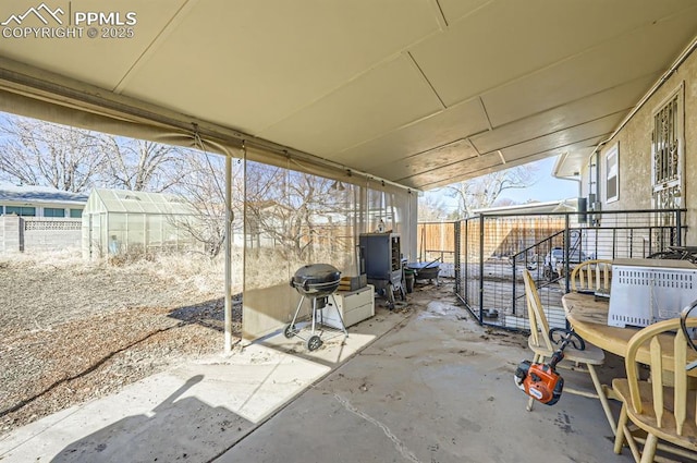 view of patio with an outbuilding and grilling area