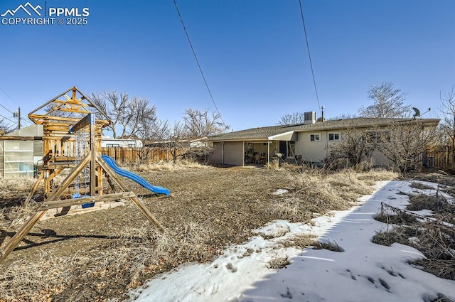 exterior space with a playground and central air condition unit