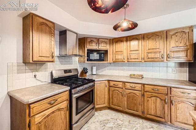 kitchen featuring black microwave, stainless steel gas range oven, decorative backsplash, and wall chimney exhaust hood