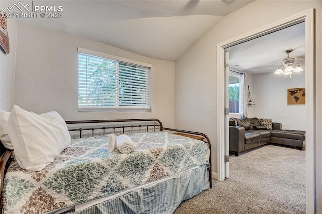 bedroom with vaulted ceiling, carpet floors, and ceiling fan