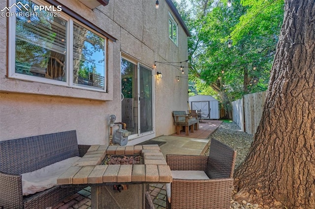 view of patio featuring a storage shed