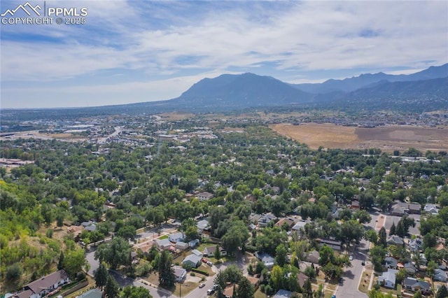 birds eye view of property with a mountain view