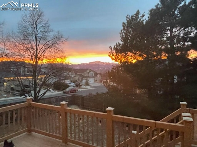 deck at dusk with a mountain view