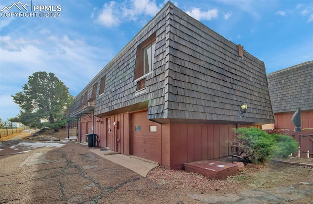 view of property exterior featuring a garage