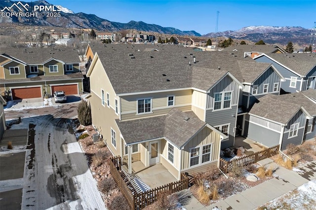 birds eye view of property featuring a mountain view