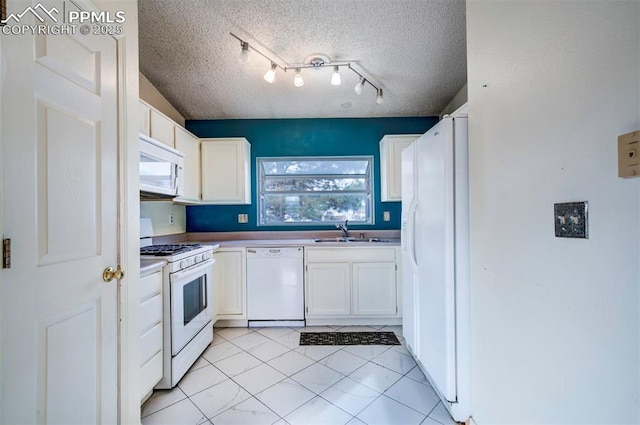 kitchen featuring white cabinets, a textured ceiling, white appliances, and sink