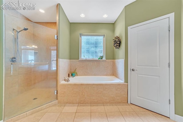 bathroom featuring plus walk in shower and tile patterned floors