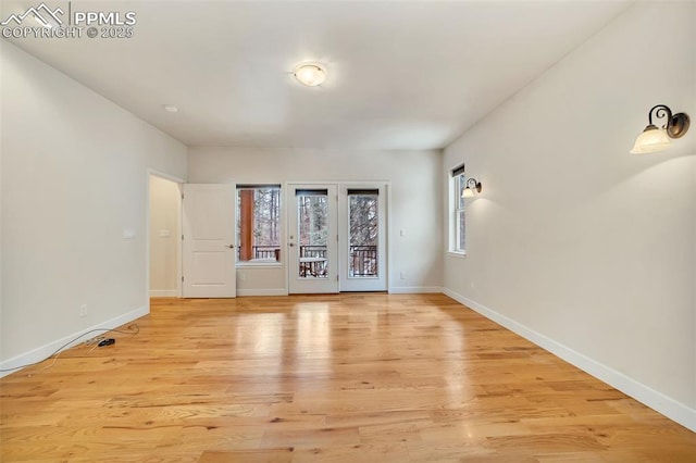 spare room featuring light hardwood / wood-style floors