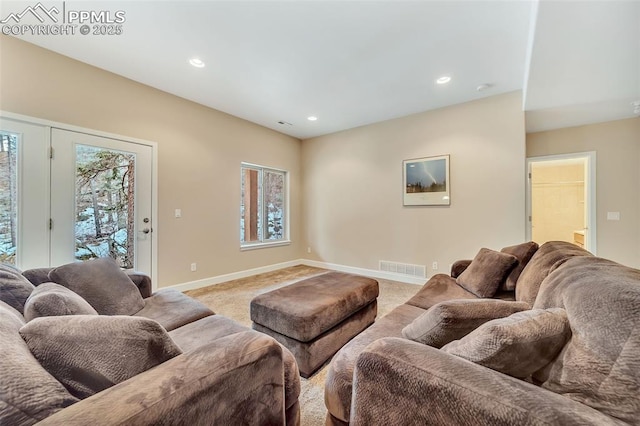 living room featuring light carpet