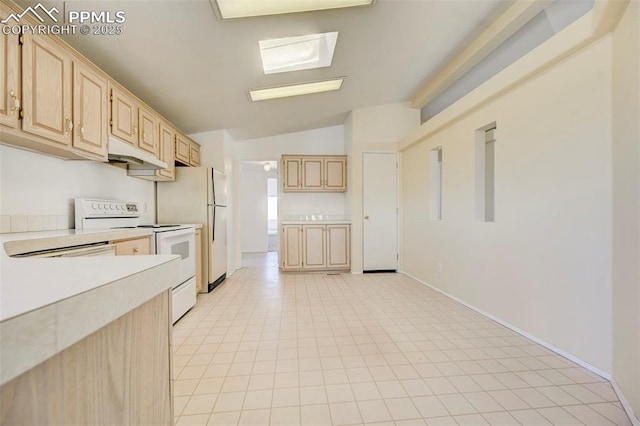 kitchen featuring light brown cabinets, white appliances, and lofted ceiling