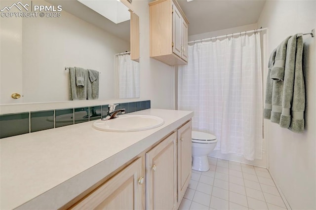 full bathroom with toilet, vanity, tile patterned floors, and shower / bathtub combination with curtain