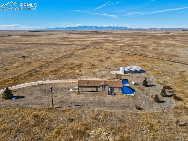 bird's eye view with a mountain view and a rural view