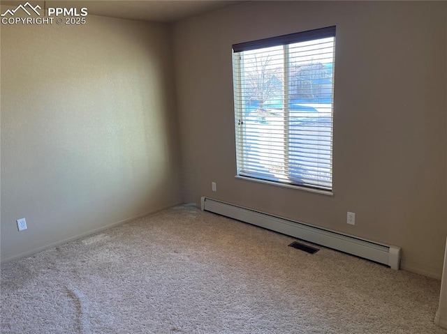 carpeted empty room with baseboard heating