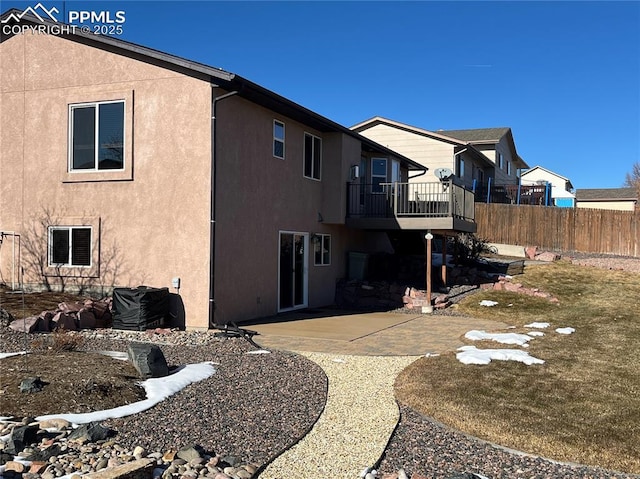 rear view of property featuring a yard