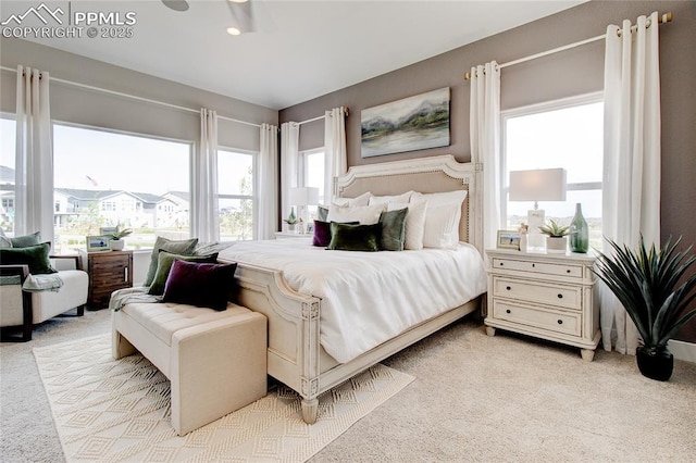 bedroom featuring ceiling fan and light colored carpet