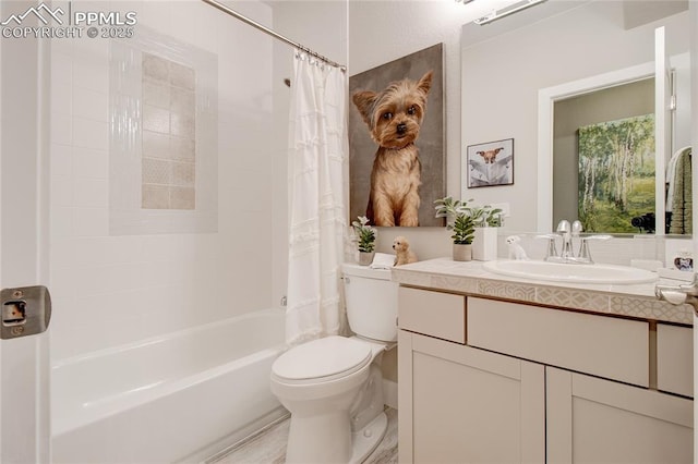 full bathroom with toilet, shower / bathtub combination with curtain, and vanity