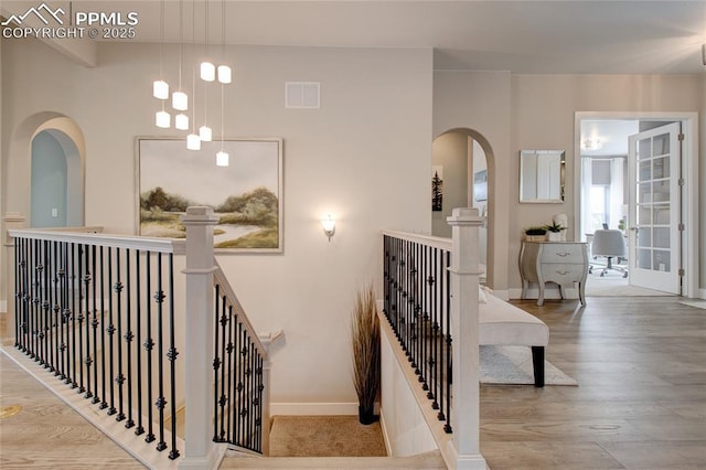 staircase featuring wood-type flooring