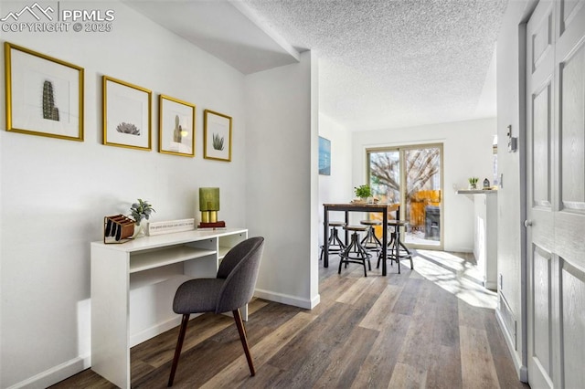 office area featuring a textured ceiling and hardwood / wood-style floors